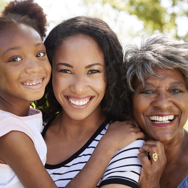 three generations of women smiling
